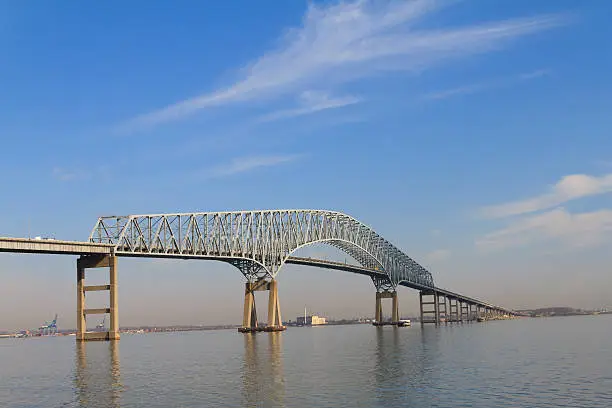 "Photo capture of the Francis Scott Key Bridge on a beautiful spring morning.  This bridge is also known as the Outer Harbor Bridge. It is a continuous truss bridge spanning the Patapsco River, and is the third longest span of any continuous truss bridge in the world.  It opened in 1977 and is named for Francis Scott Key, the author of the Star Spangled Banner."