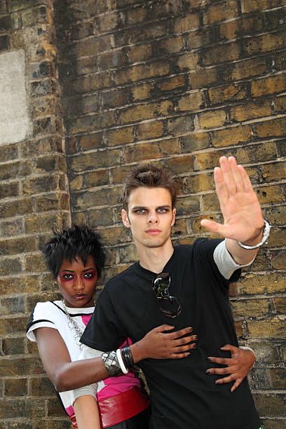 istock male goth is aggressive and restrained by black punk girlfriend 183868519