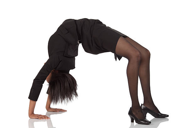 istock Businesswoman bending over backwards for you 183868533