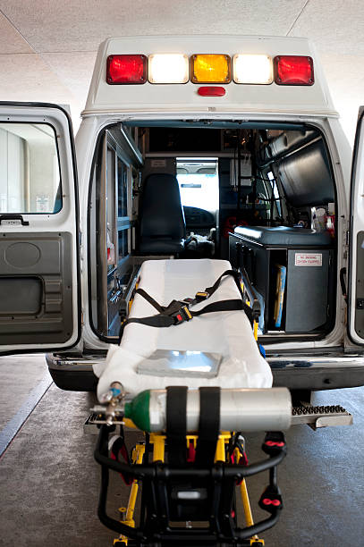 The back on an ambulance with a gurney for patient transport stock photo