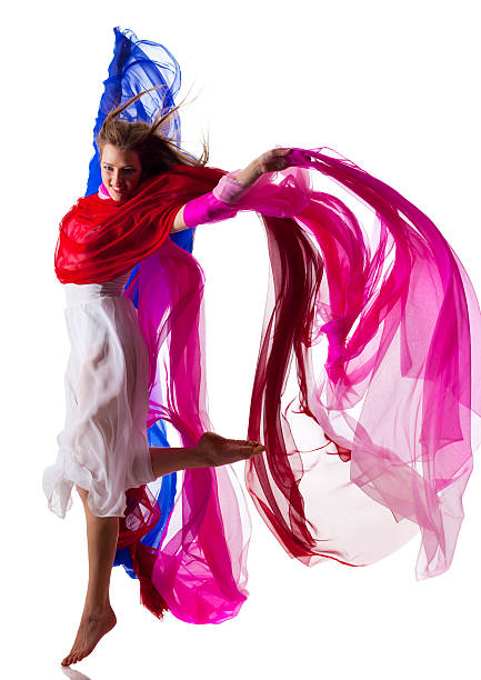 istock Dancer jump on white background with colorful fabric 183870047