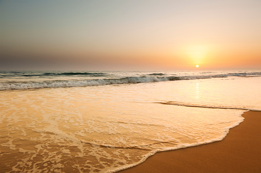 Beautiful orange sunset on the sea shore