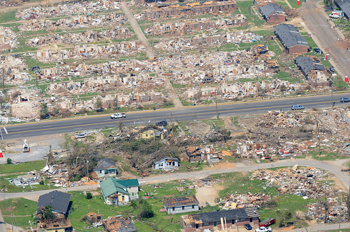 Neighborhood completely demolished by tornado as viewed from the air.