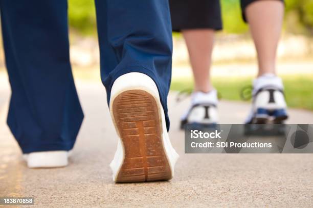 Closeup Of Walkers Shoes On A Pathway Stock Photo - Download Image Now - Active Lifestyle, Activity, Adult