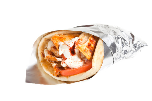 Chicken Gryo with Tomatoes and tzatziki. Wrapped in foil.Isolated on white. XXL files size is available. Click here for more images of Fast Food: