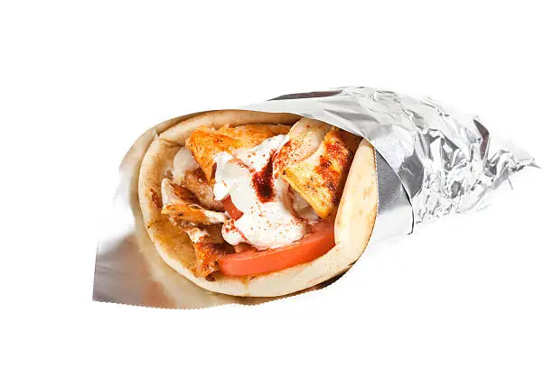 Chicken Gryo with Tomatoes and tzatziki. Wrapped in foil.Isolated on white. XXL files size is available. Click here for more images of Fast Food: