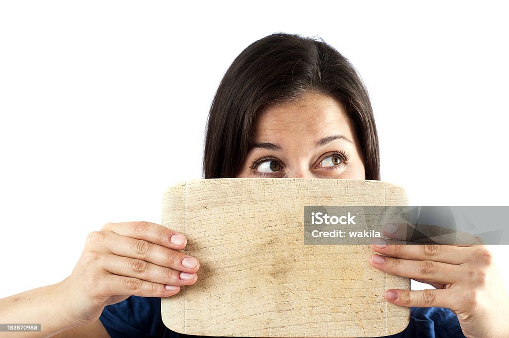 be a blockhead woman with a piece of wood befiore the head. be a blockhead Adult Stock Photo