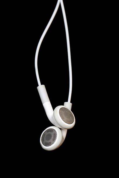 istock White headphones on black 183871517