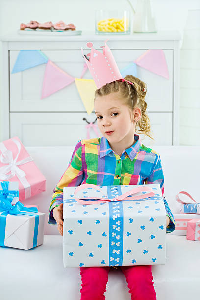 istock Cute girl with birthday present 183871594