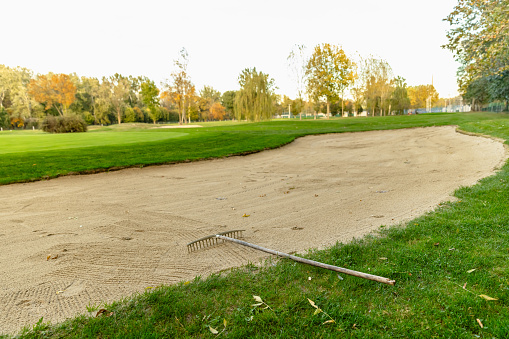 Sand rakes on the golf course - Stock Photo