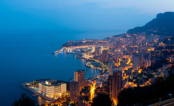 XXXL Monaco (Monte Carlo) by night panoramic A beautiful view of Monte Carlo (Monaco) at dusk. monaco stock pictures, royalty-free photos & images