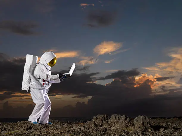 "Astronaut with computer, dark, moody lunar skySee more like this:"