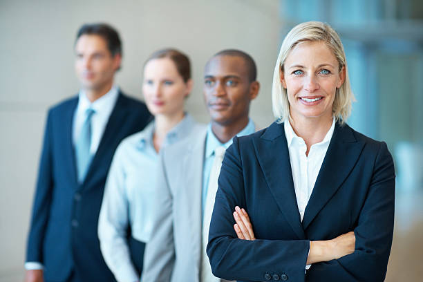 istock Happy, female executive with arms crossed 183874170