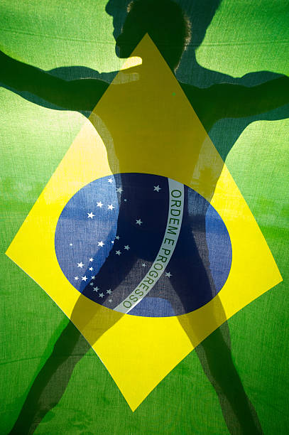istock Brazilian Flag Full Frame with Shadow Silhouette of Man 183874401