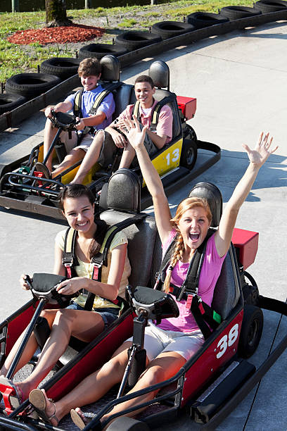 istock Teenagers riding go-carts 183875524