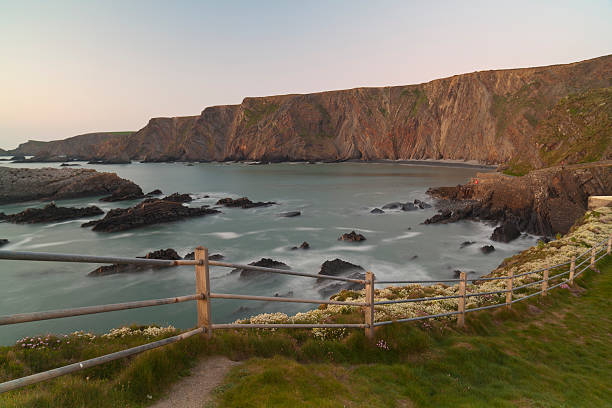 leuchtturm hartland quay - devon north devon sunset multi colored stock-fotos und bilder