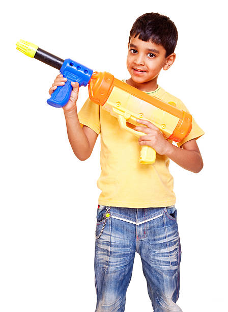Japanese boy playing with water gun (first grade at elementary school)