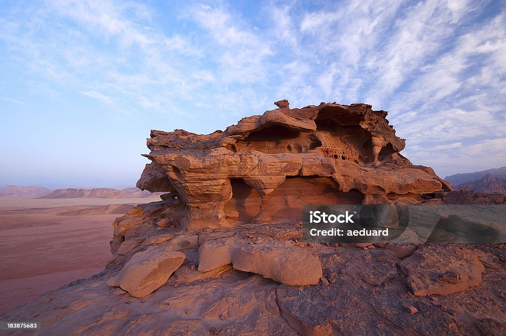 Wind erosion on sandstone formations "Beautiful formations on sandstone, carved by wind (eolian) erosion in Wadi Rum, Jordan." Eroded Stock Photo