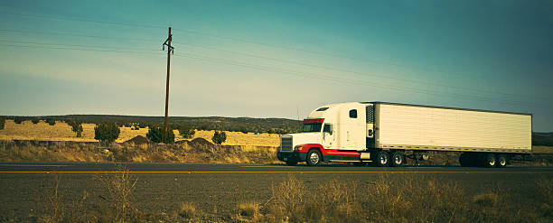 istock semi-truck on the highway 183875693