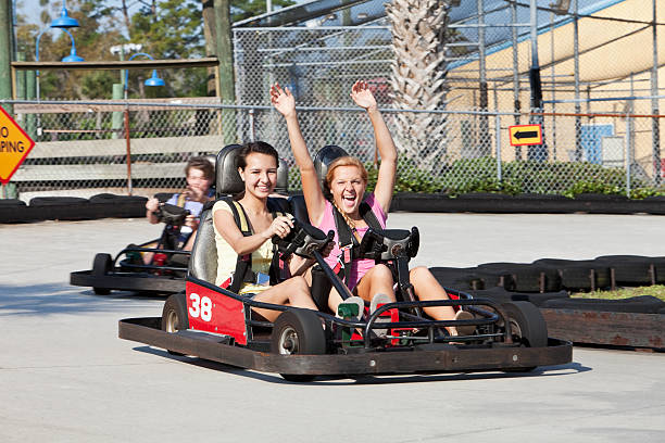 istock Teenagers riding go-carts 183875817