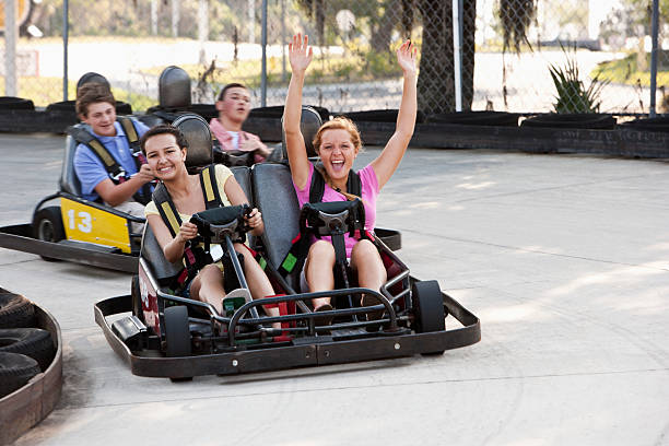istock Teenagers riding go-carts 183875818
