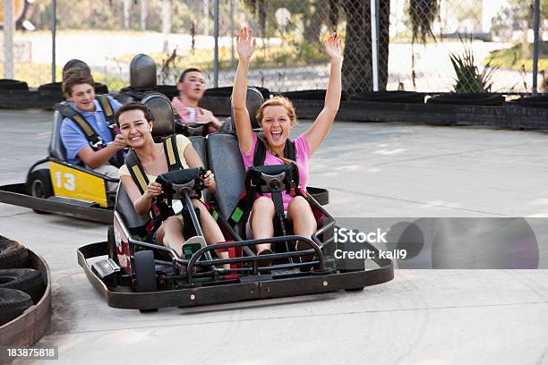 Teenagers Riding Gocarts Stock Photo - Download Image Now - Go-cart, Fun, Go-Carting