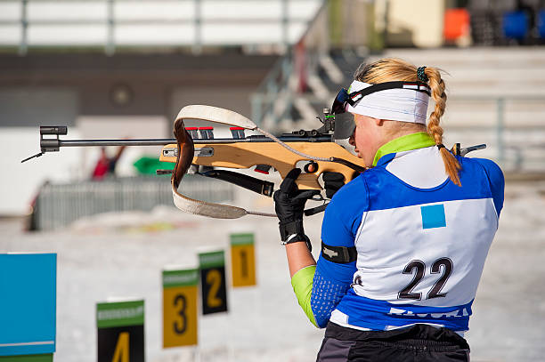 istock Female shooting at biathlon competition 183876724