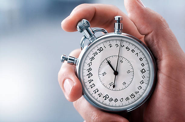 Hand with classic stopwatch Male hand with classic stopwatch. (XXL-File) stop watch stock pictures, royalty-free photos & images