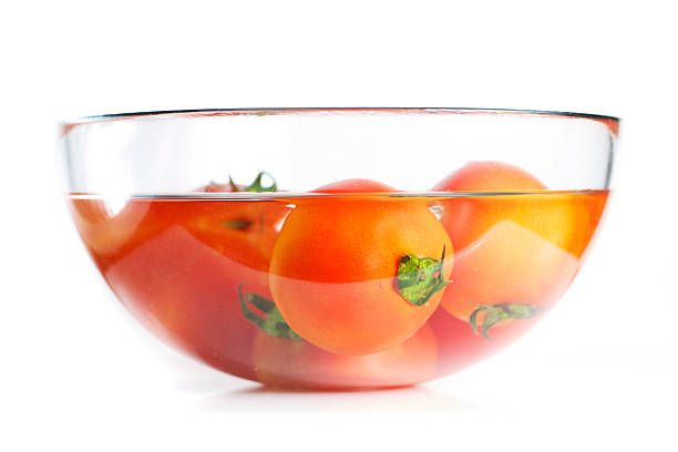 Fresh tomatos in glass bowl