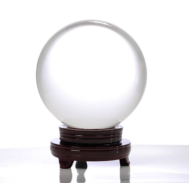 istock Crystal ball on a brown stand with a white background 183877968