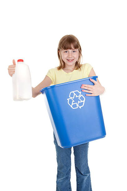 istock Young Girl Recycling Milk Container 183879072