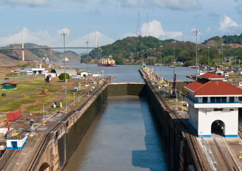 Pedro Miguel Locks Panama Canal with the Centennial Bridge (New Millenium Bridge) in the background.