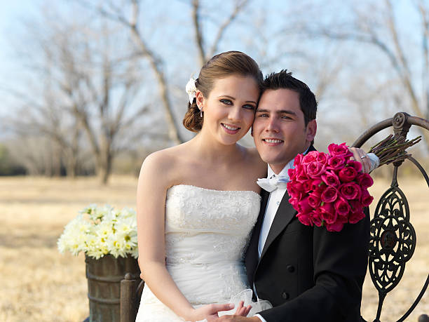 Bride and groom smiling at the camera portrait