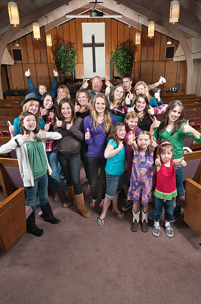 istock People in Church Smiling with Thumbs Up 183879761