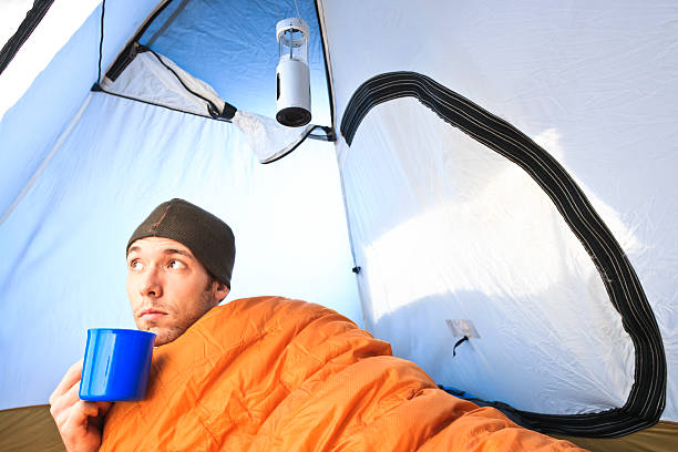 Waking up in a tent stock photo