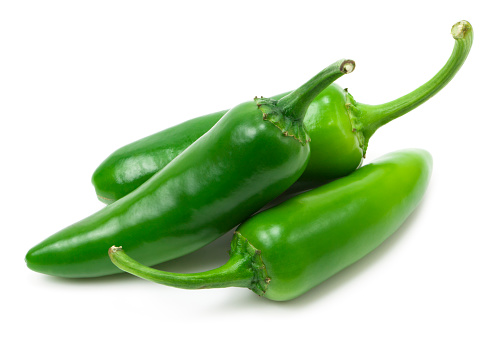 Fresh jalapeno peppers on white background