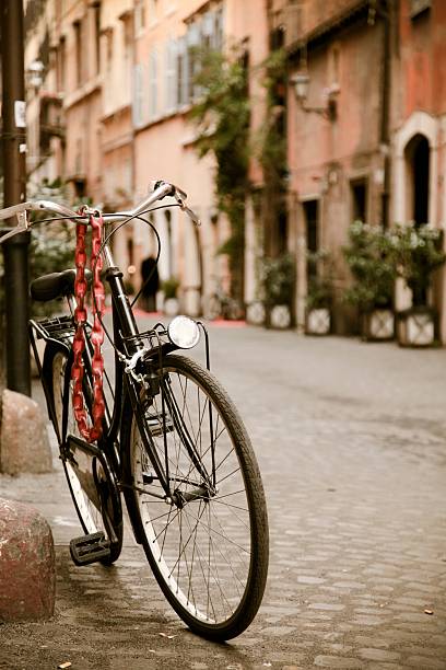 istock Locked bicycle in Rome back street 183881548