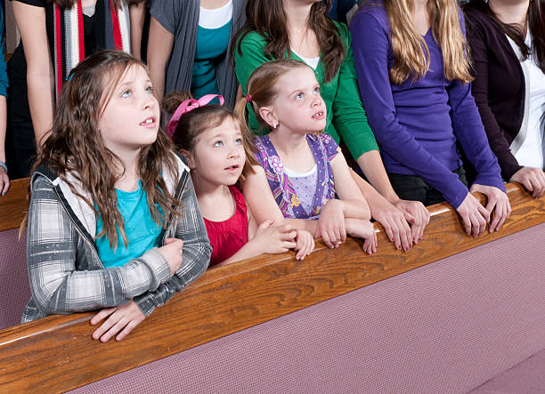 istock Little Girls Paying Attention to Sermon 183882079