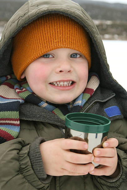 istock Child with Hot Chocolate from thermos outside 183882369