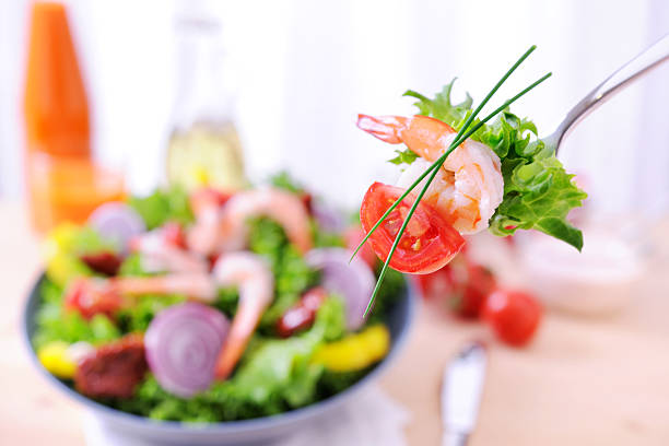 Shrimp salad, with king prawns, mixed greens, cherry tomatoes and capsicum.  Healthy seafood meal.  Please see:\n[url=http://www.istockphoto.com/my_lightbox_contents.php?lightboxID=3705122] [img]http://robynm.smugmug.com/photos/264244565_DnNb4-L.jpg [/img][/url]\n \nPlease see also:\n[url=http://www.istockphoto.com/my_lightbox_contents.php?lightboxID=2001163] [img]http://robynm.smugmug.com/photos/175548406-L.jpg [/img][/url] [url=file_closeup.php?id=4387935][img]file_thumbview_approve.php?size=1&id=4387935[/img][/url] [url=file_closeup.php?id=4409587][img]file_thumbview_approve.php?size=1&id=4409587[/img][/url] [url=file_closeup.php?id=4387952][img]file_thumbview_approve.php?size=1&id=4387952[/img][/url]