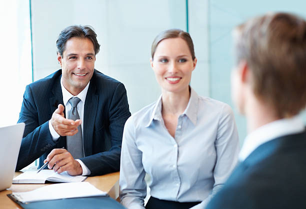 istock Business man smiling and discussing during a meeting 183882610