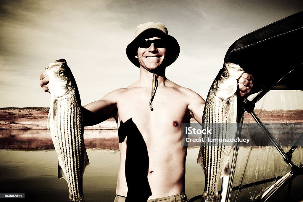 ストライプバスジョンフィッシング Lake Powell - 釣りをするのロイヤリティフリーストックフォト