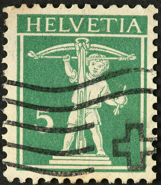 istock young boy with a crossbow on old Swiss postage stamp 183883071