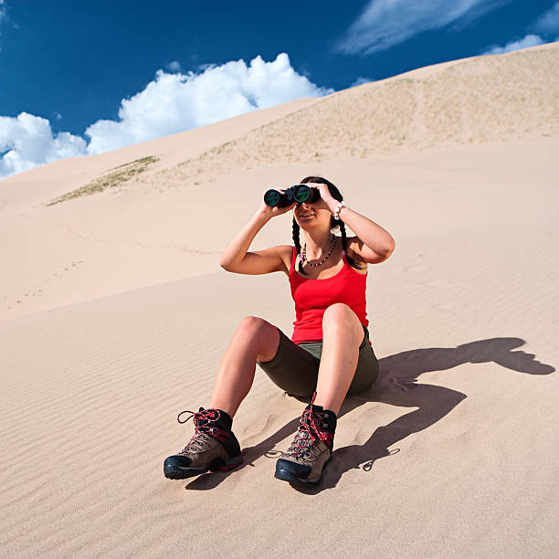 asian woman photographer standing in a national geological park taking a picture