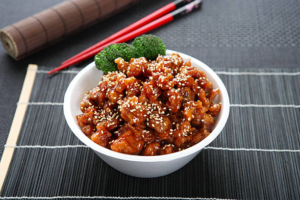 Sesame Chicken Teriyaki Bowl Sesame Chicken Teriyaki Bowl with Steamed Rice rice bowl restaurant stock pictures, royalty-free photos & images