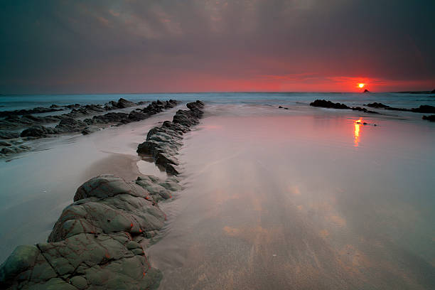 hartland ledges. - devon north devon sunset multi colored stock-fotos und bilder