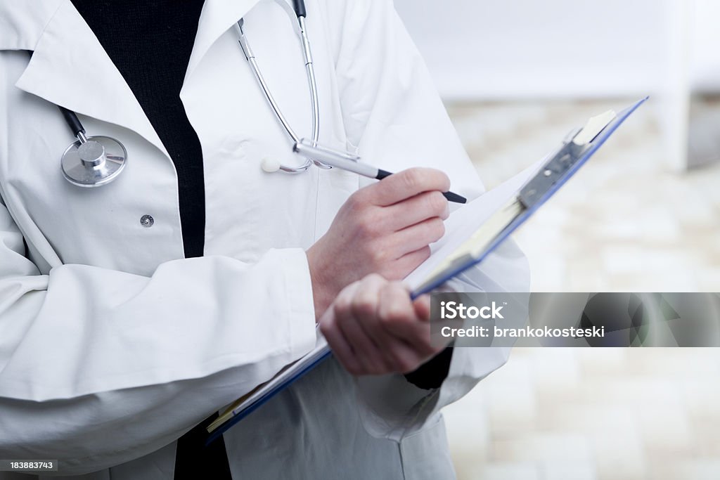 Prescribing treatment Detail of young female doctor prescribing treatment Adult Stock Photo
