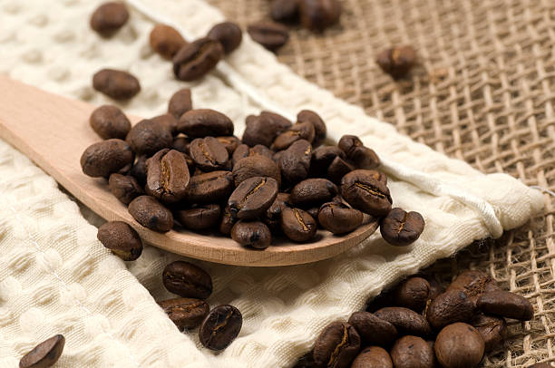 istock coffee crop on wooden spoon 183883761