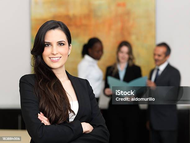 Confident Business Woman With Her Team Stock Photo - Download Image Now - Adult, African Ethnicity, African-American Ethnicity