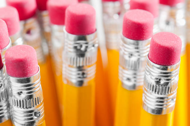 istock Yellow pencils with red rubbers attached to ends 183884091